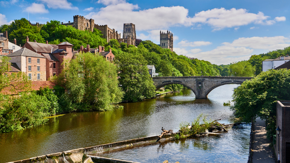 Landscape image of beautiful Durham City showing Catehdral and Castle on a sunny day